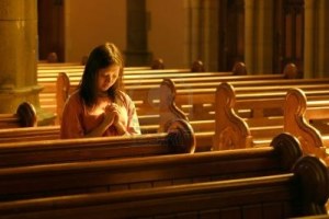 240334-woman-praying-at-church